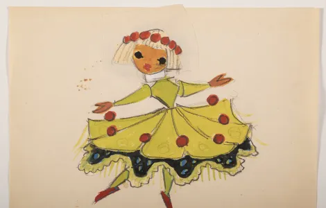 Postać kobiety z blond włosami z grzywką, w czerwonym wianku na głowie, kobieta ubrana w żółtą rozkloszowaną sukienkę z ozdobną falbaną na dole, z czerwonymi okrągłymi akcentami. 