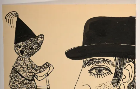 Niedźwiadek na rowerze, mężczyzna w kapeluszu z czarnymi wąsami